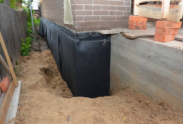 SJ Waterproofing Pros technician performing targeted Foundation Crack Repair assessment in Arcola, IL